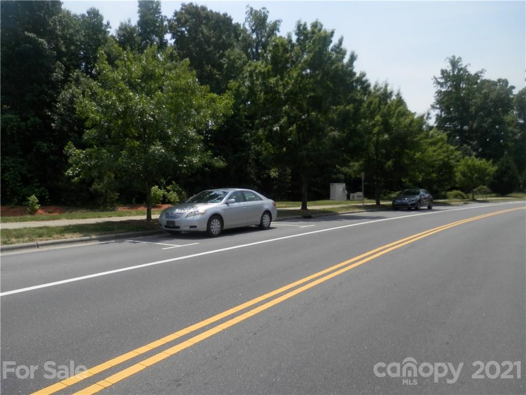 5057 Prosperity Church Road Charlotte, NC 28269 - Photo 23 of 24 a view of street with parked cars