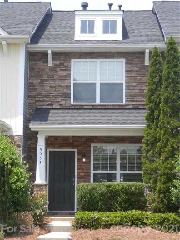 5057 Prosperity Church Road Charlotte, NC 28269 - Photo 24 of 24 a view of a building with a window and balcony