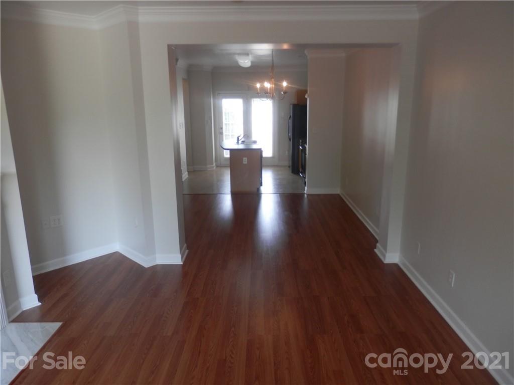 5057 Prosperity Church Road Charlotte, NC 28269 - Photo 4 of 24 a view of gallery with wooden floor