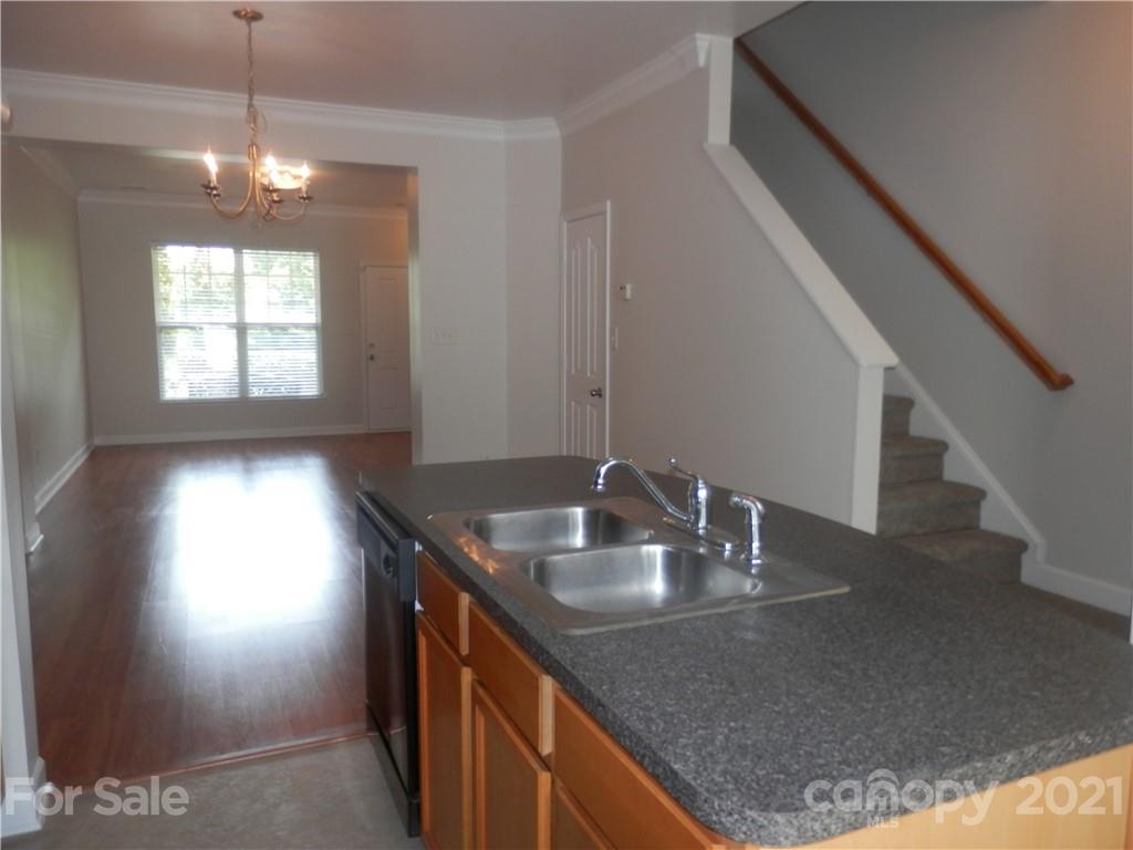 5057 Prosperity Church Road Charlotte, NC 28269 - Photo 10 of 24 a kitchen with sink granite and a window