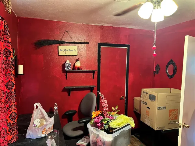 a bathroom with a sink mirror and toilet