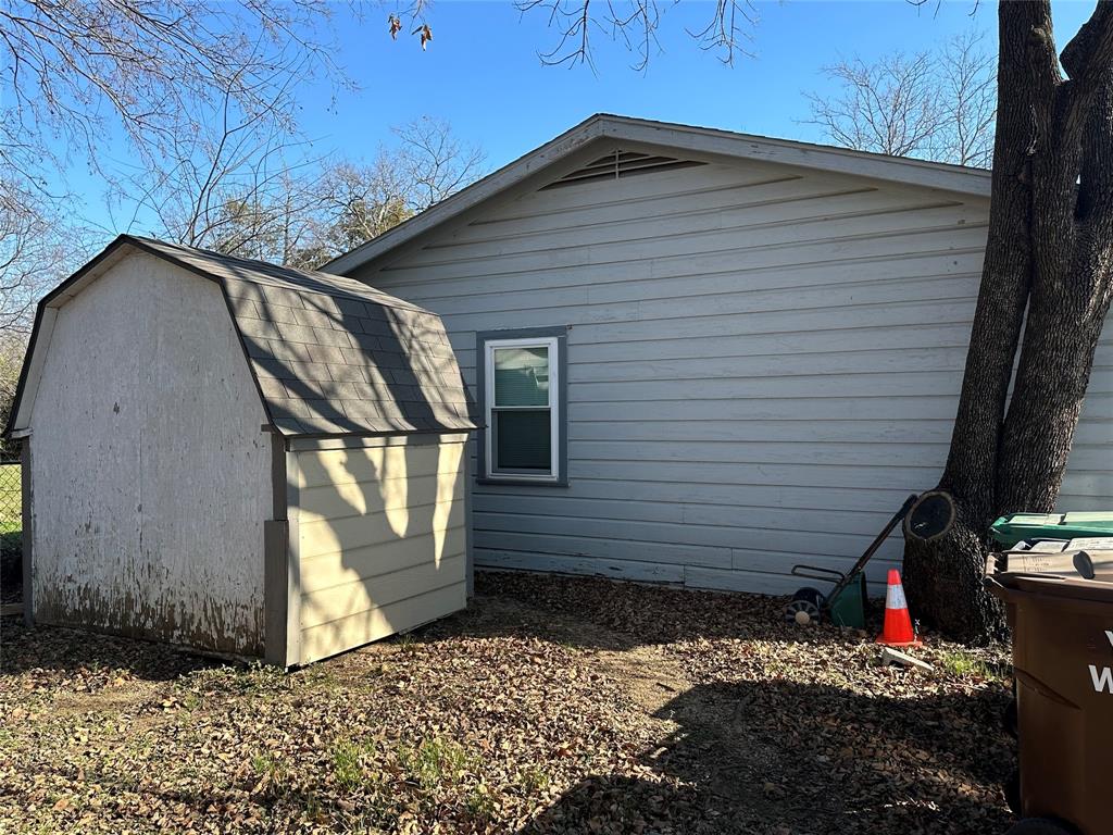 1709 Lattimore Street Denton, TX 76209 - Photo 14 of 23 a view of a house with a yard