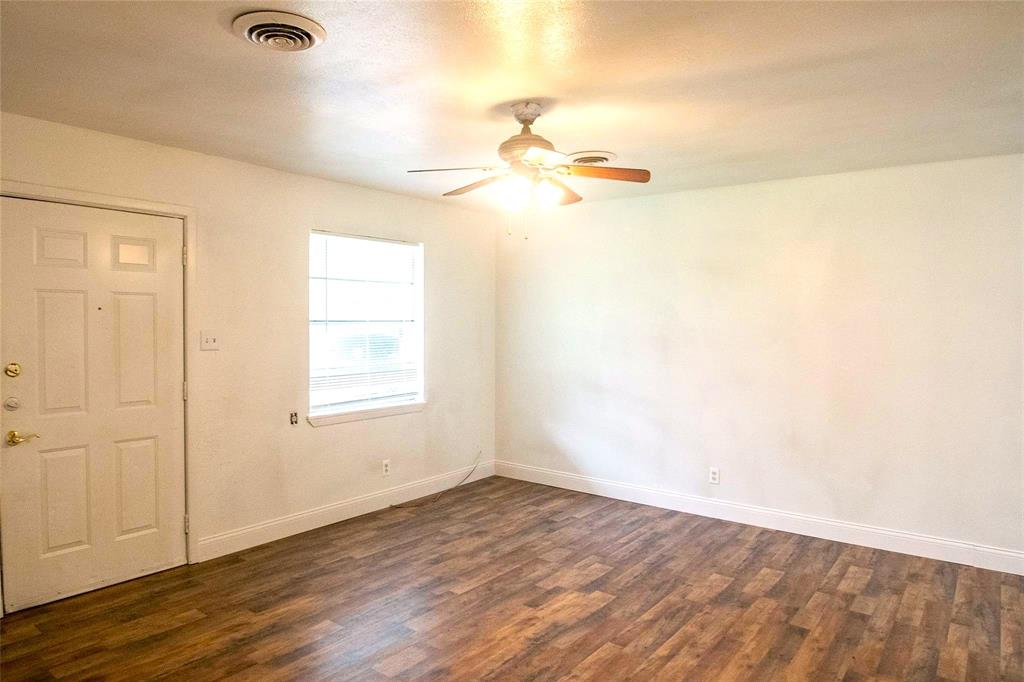 1709 Lattimore Street Denton, TX 76209 - Photo 6 of 23 an empty room with wooden floor and windows