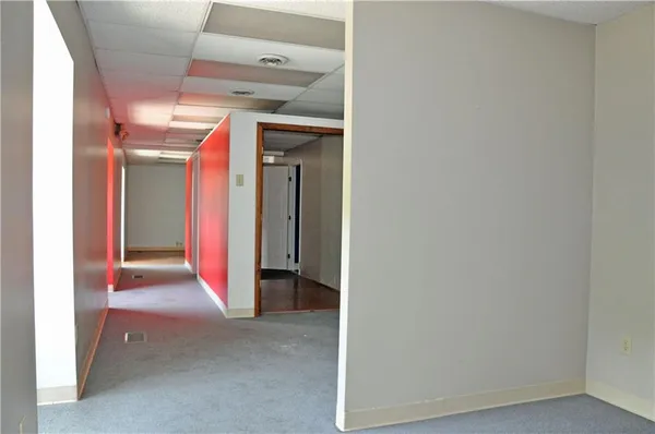 a view of a room with wooden walls