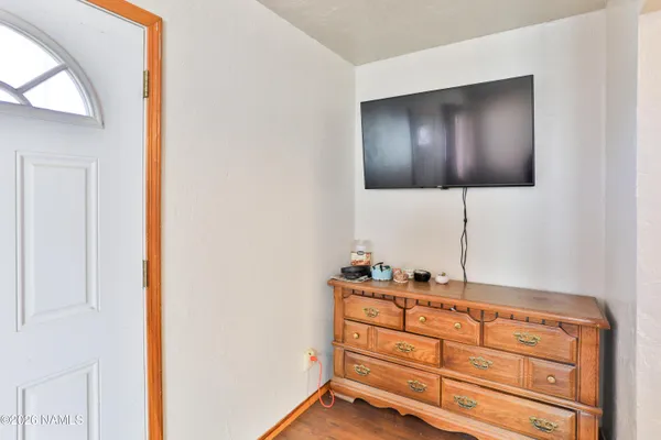 a room with mirror cabinet and window
