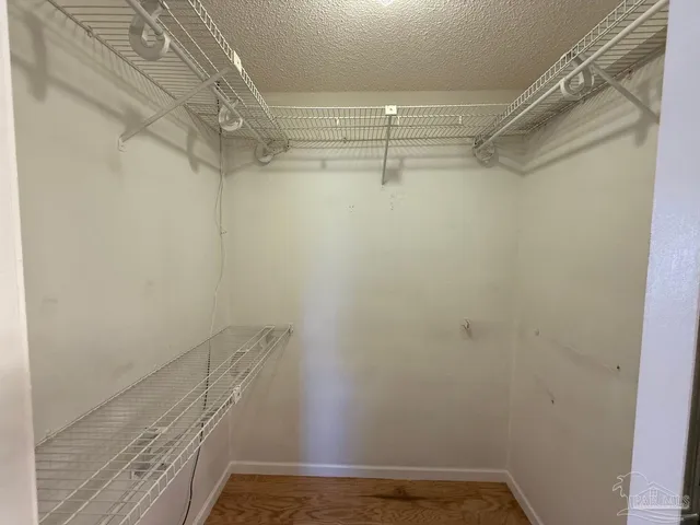 a view of a room with racks on the wall