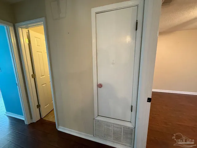 a view of a bathroom with wooden floor