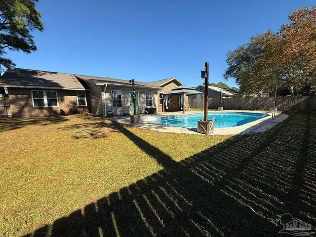 a view of a swimming pool with a patio