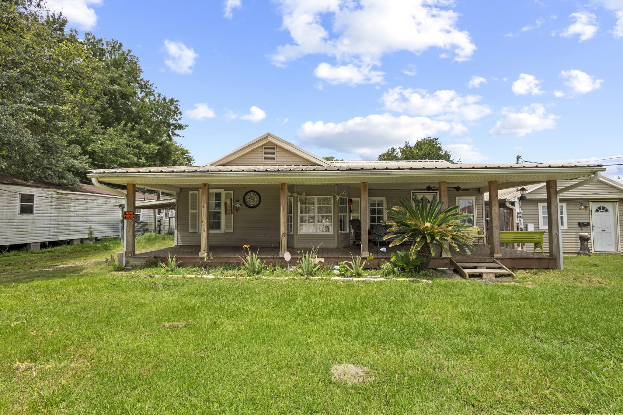 100 6th Avenue Nederland, TX 77627 - Photo 1 of 6 a view of a house with a yard and sitting area