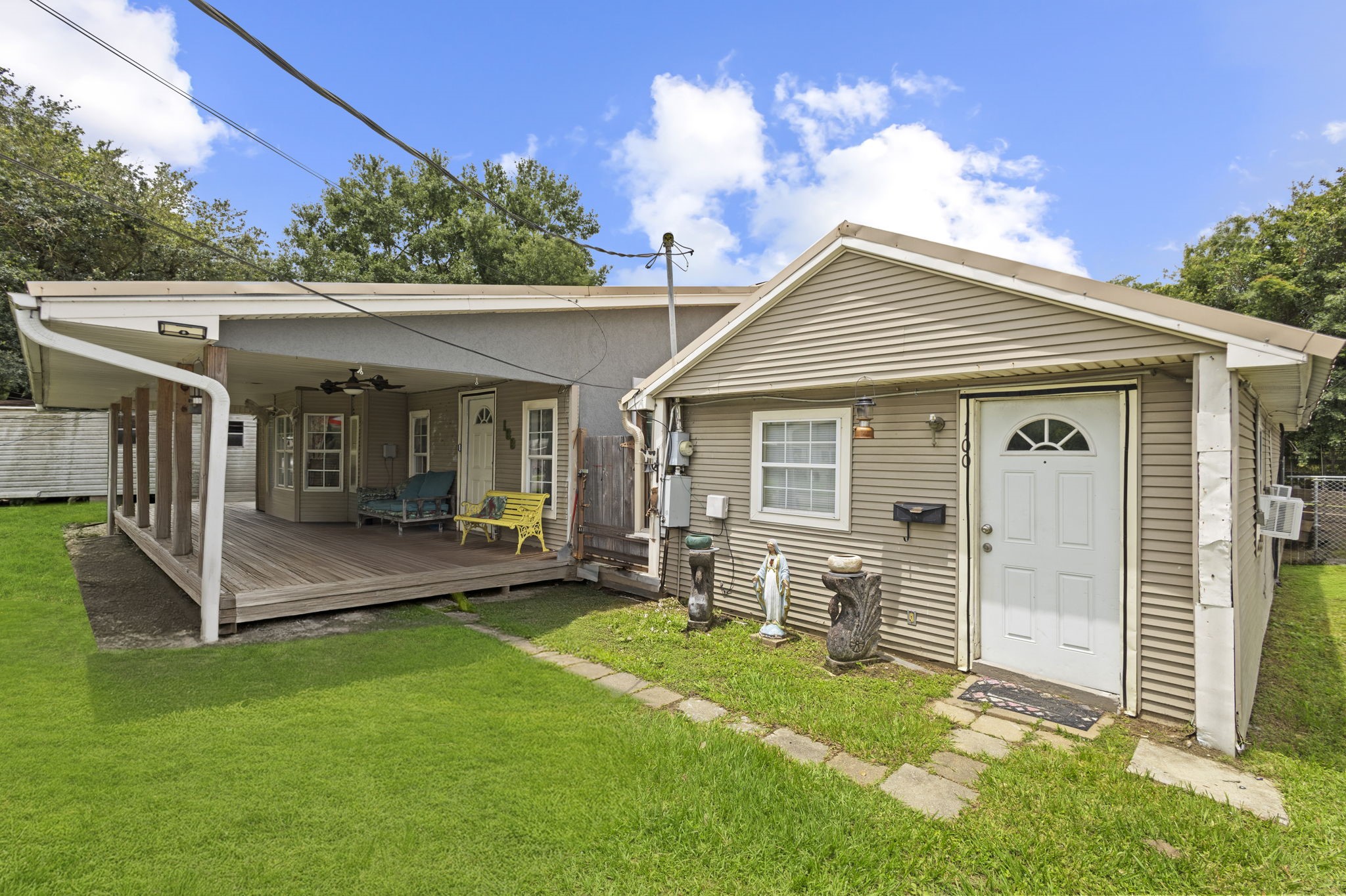 100 6th Avenue Nederland, TX 77627 - Photo 2 of 6 a view of a house with a yard and furniture
