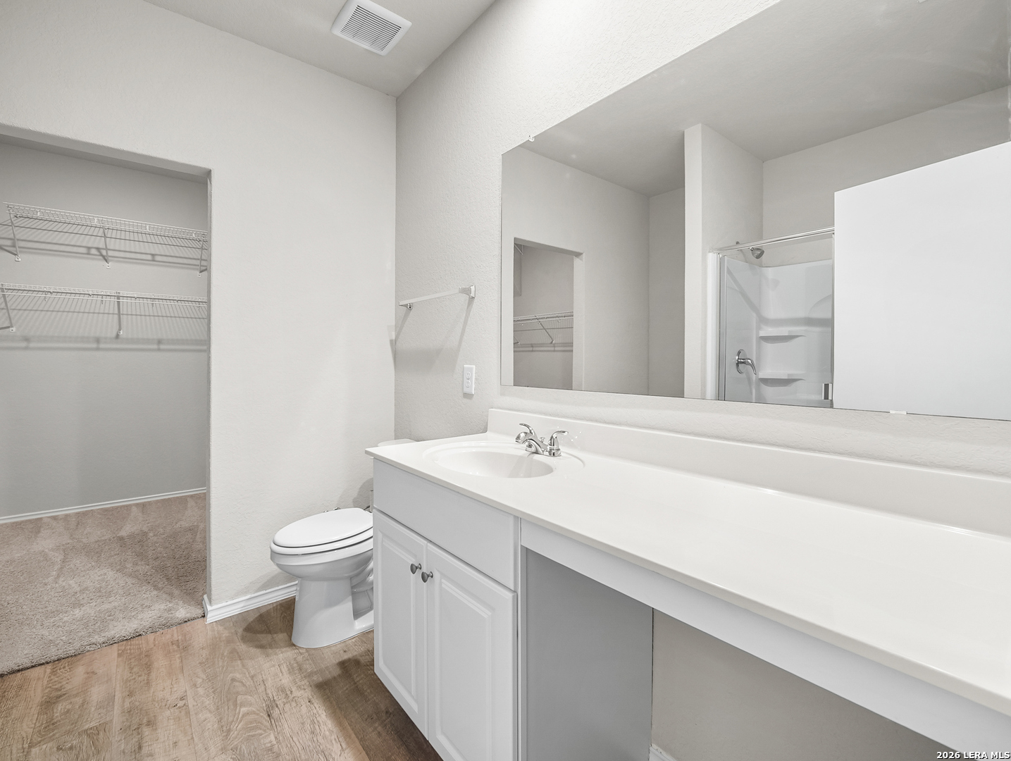 3019 Pacific Coast Converse, TX 78109 - Photo 13 of 31 a bathroom with a sink a toilet and a mirror