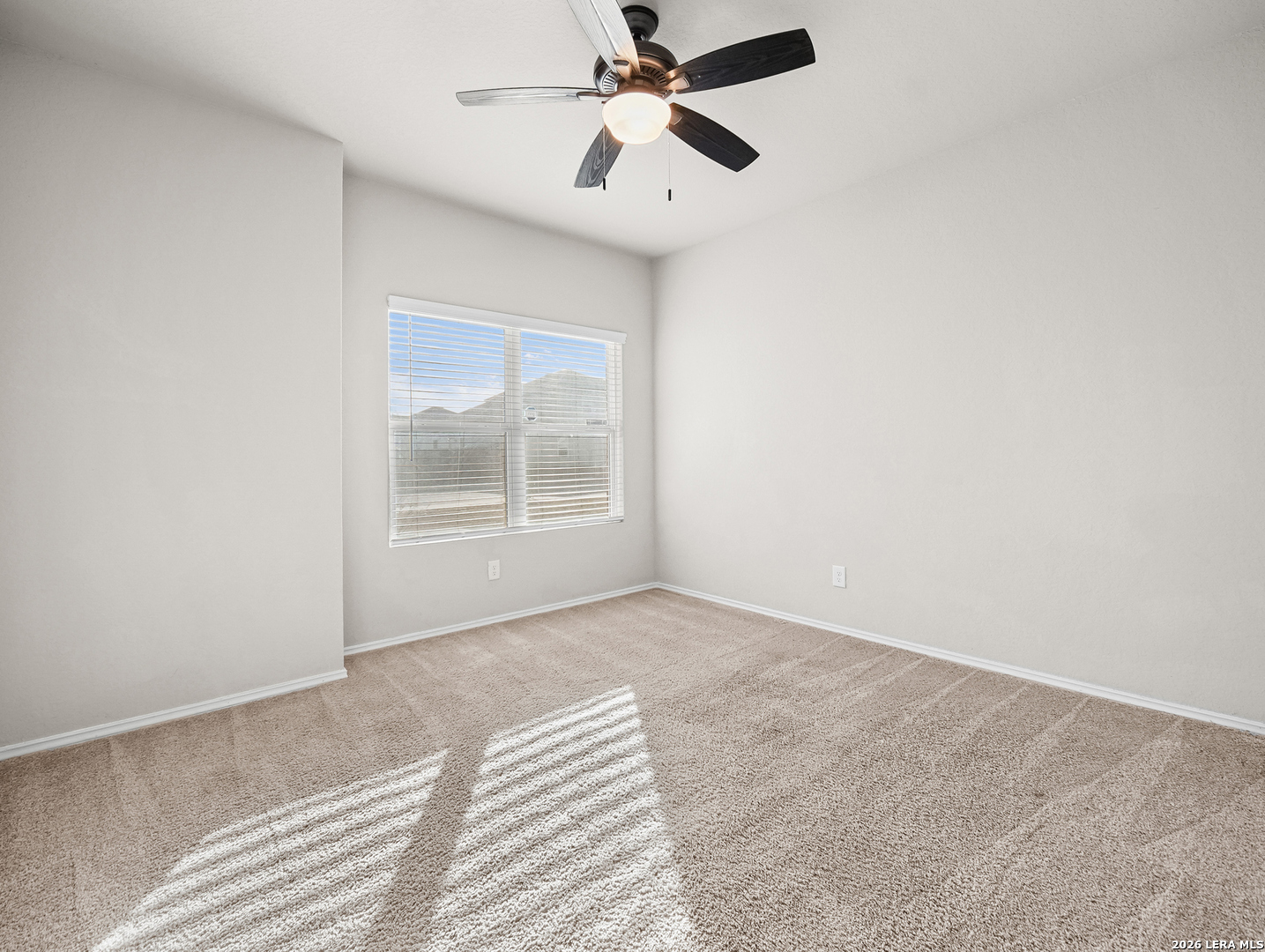 3019 Pacific Coast Converse, TX 78109 - Photo 16 of 31 an empty room with windows and fan