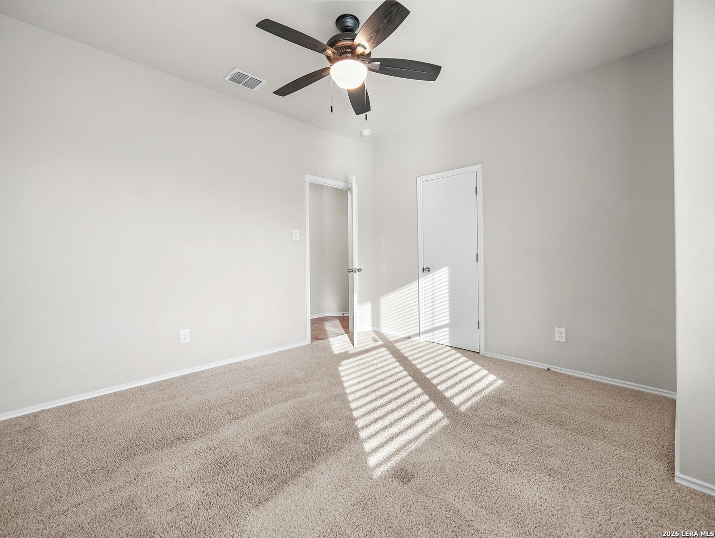 3019 Pacific Coast Converse, TX 78109 - Photo 17 of 31 a view of an empty room with a fan