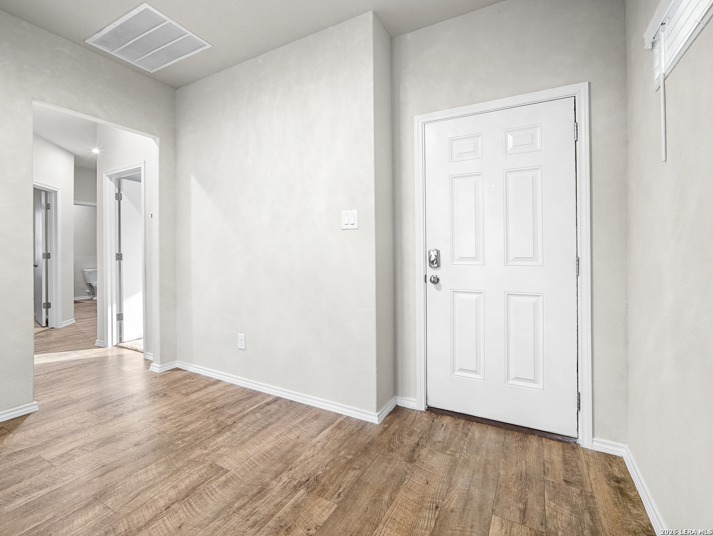 3019 Pacific Coast Converse, TX 78109 - Photo 4 of 31 an empty room with wooden floor