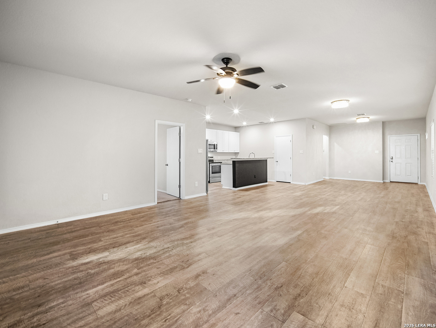 3019 Pacific Coast Converse, TX 78109 - Photo 10 of 31 a view of an empty room with kitchen and a window