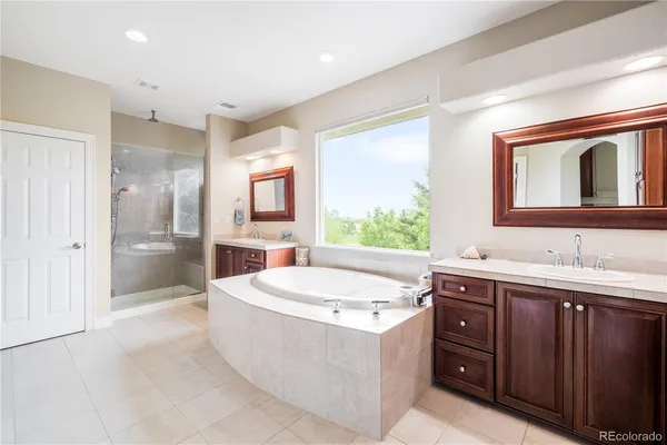 a large white room with a large mirror next to a white walls