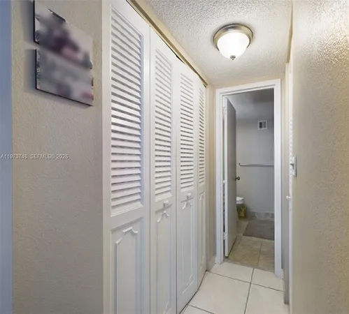 a view of a bathroom from a hallway