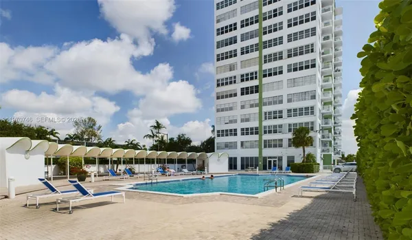 a view of a building with a yard