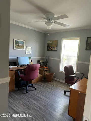 a view of sitting area with furniture and wooden floor