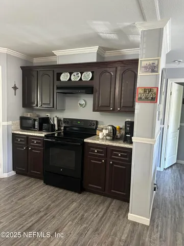 a bedroom with a bed dresser and a window