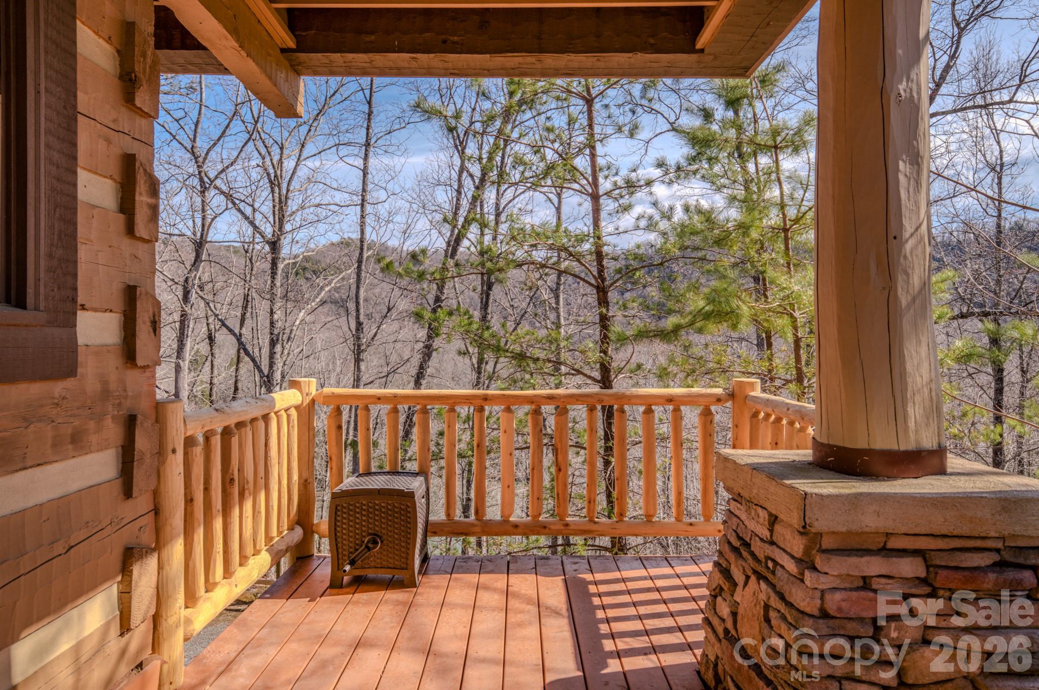 277 Long Ridge Road, Unit 882 889 Old Fort, NC 28762 - Photo 17 of 41 a view of a balcony with wooden floor and outdoor seating