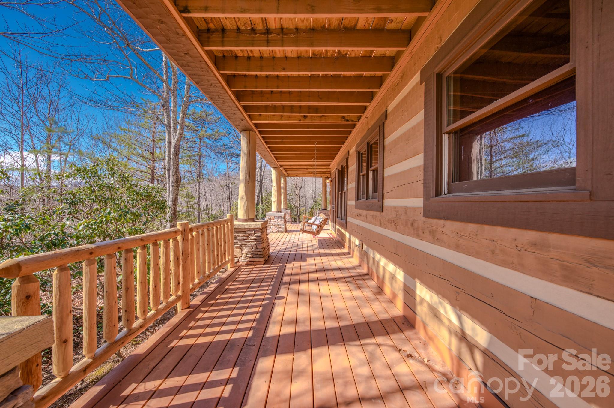 277 Long Ridge Road, Unit 882 889 Old Fort, NC 28762 - Photo 18 of 41 a view of balcony with wooden floor and book