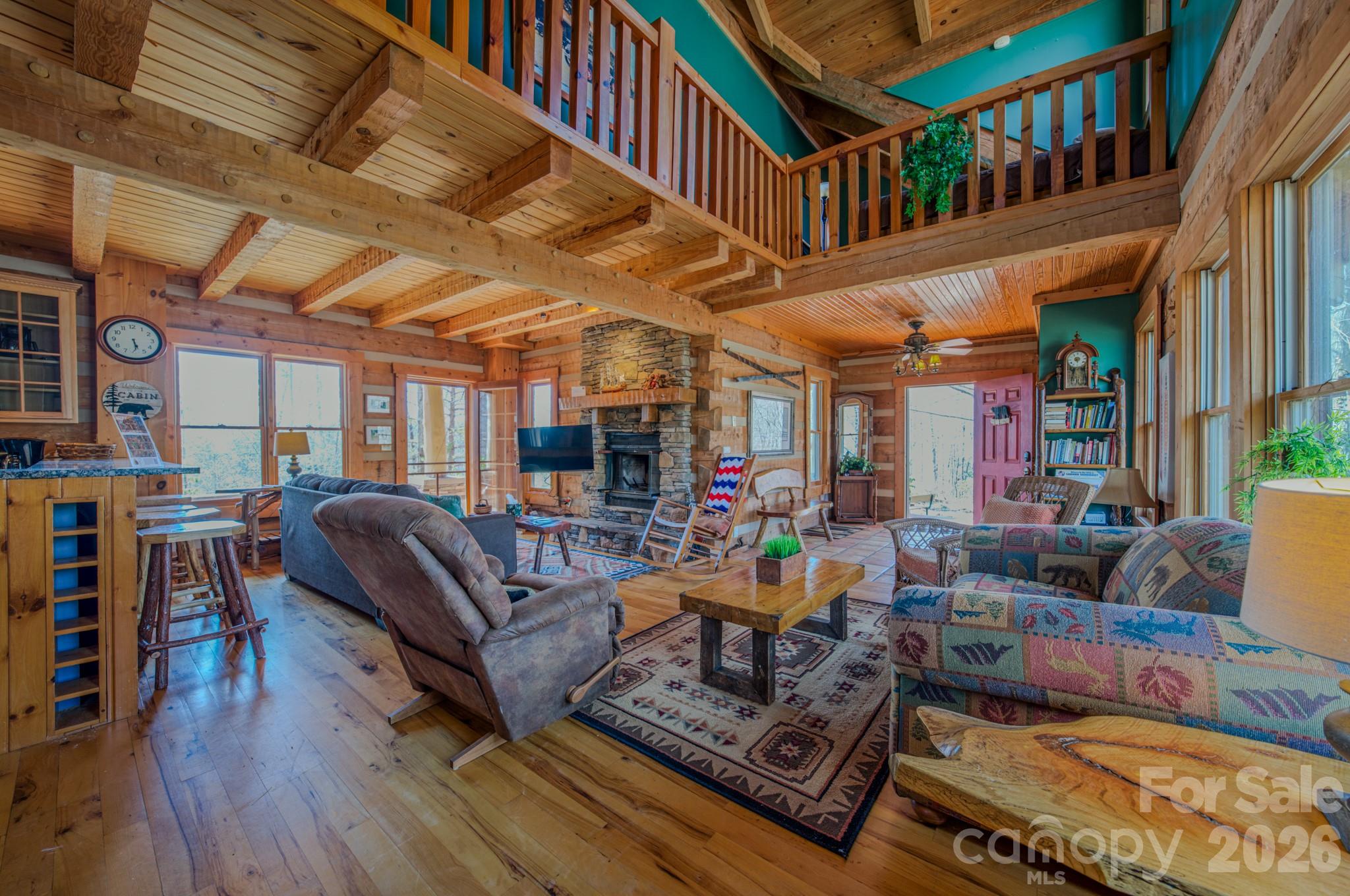 277 Long Ridge Road, Unit 882 889 Old Fort, NC 28762 - Photo 24 of 41 a living room with lots of furniture and a book shelf