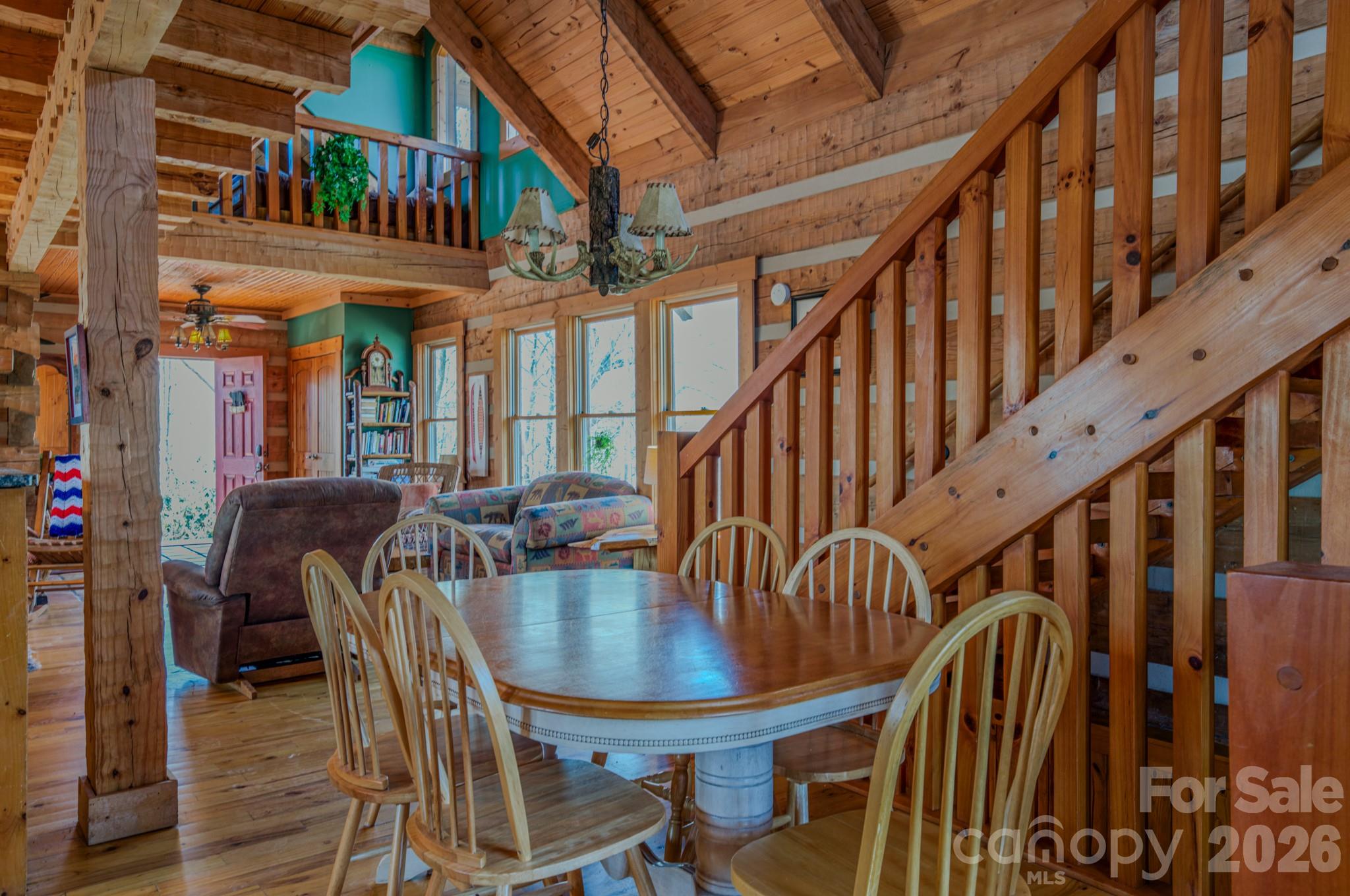 277 Long Ridge Road, Unit 882 889 Old Fort, NC 28762 - Photo 26 of 41 a view of a dining room with furniture and a chandelier