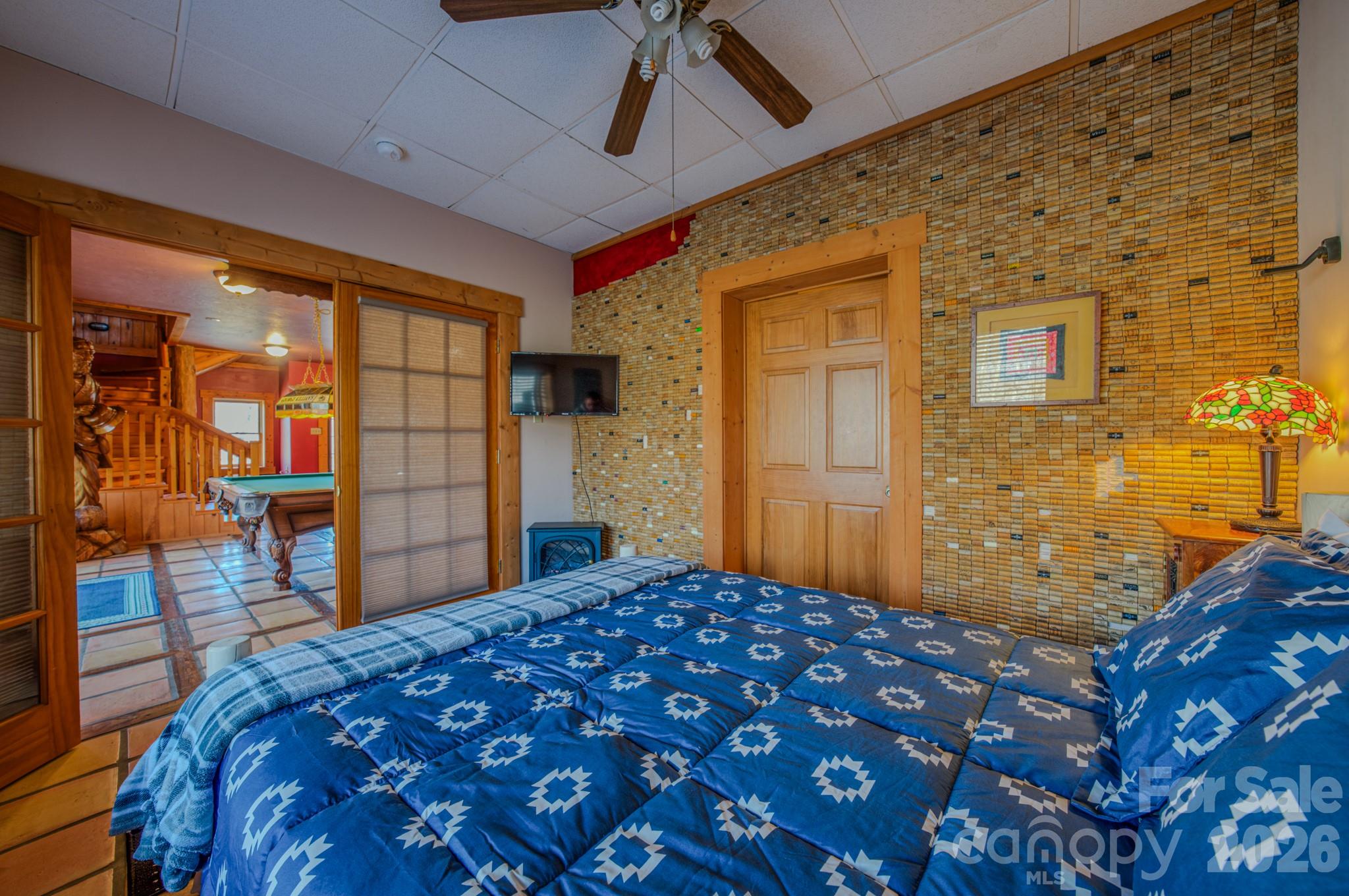 277 Long Ridge Road, Unit 882 889 Old Fort, NC 28762 - Photo 30 of 41 a bedroom with a bed and a dresser