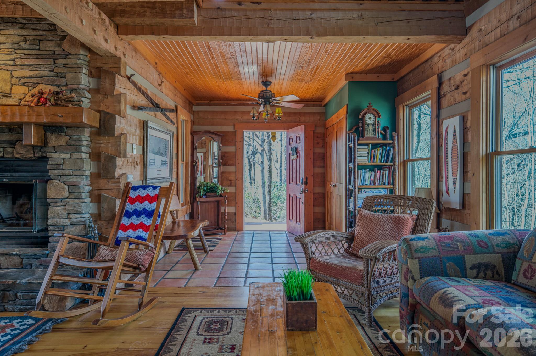 277 Long Ridge Road, Unit 882 889 Old Fort, NC 28762 - Photo 31 of 41 a living room with furniture a fireplace and a chandelier