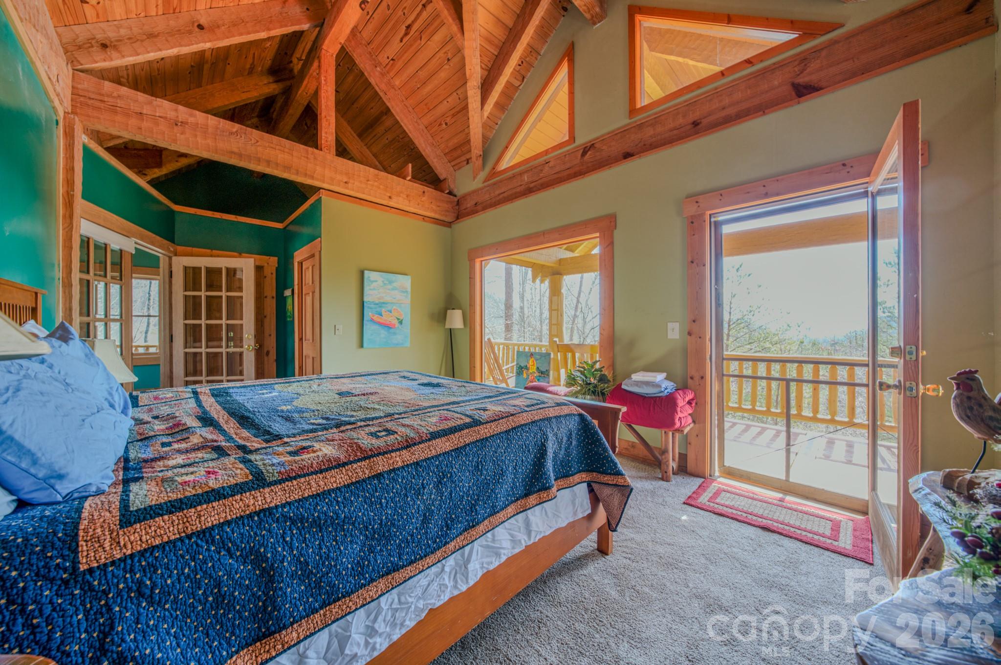 277 Long Ridge Road, Unit 882 889 Old Fort, NC 28762 - Photo 35 of 41 a bed sitting in front of a bedroom next to a window