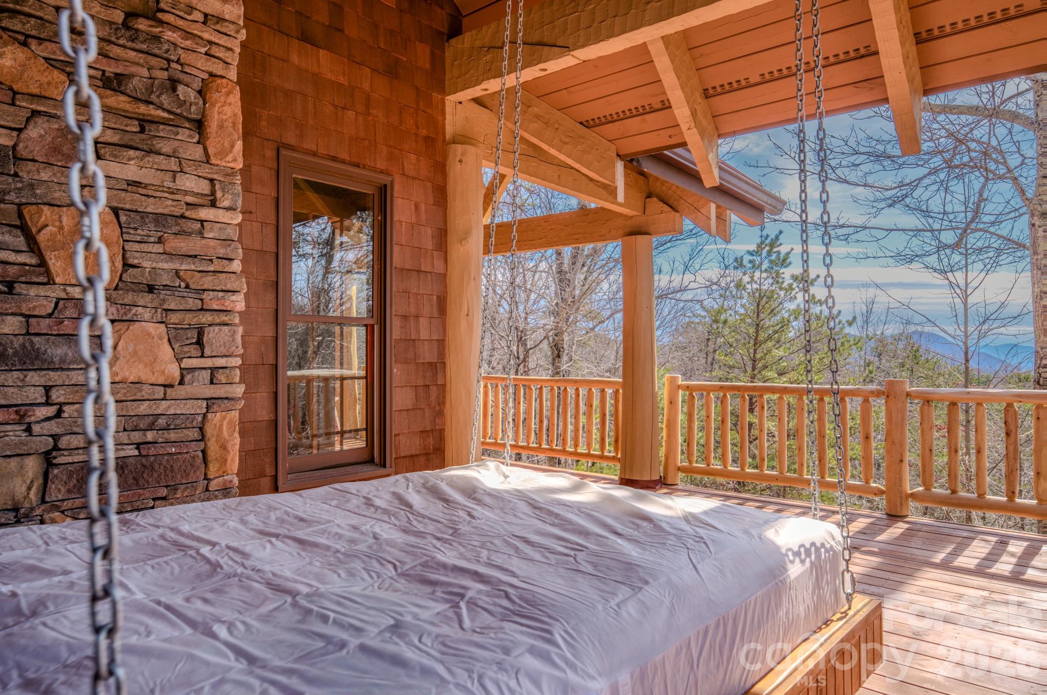 277 Long Ridge Road, Unit 882 889 Old Fort, NC 28762 - Photo 36 of 41 a bedroom with a bed and a large window