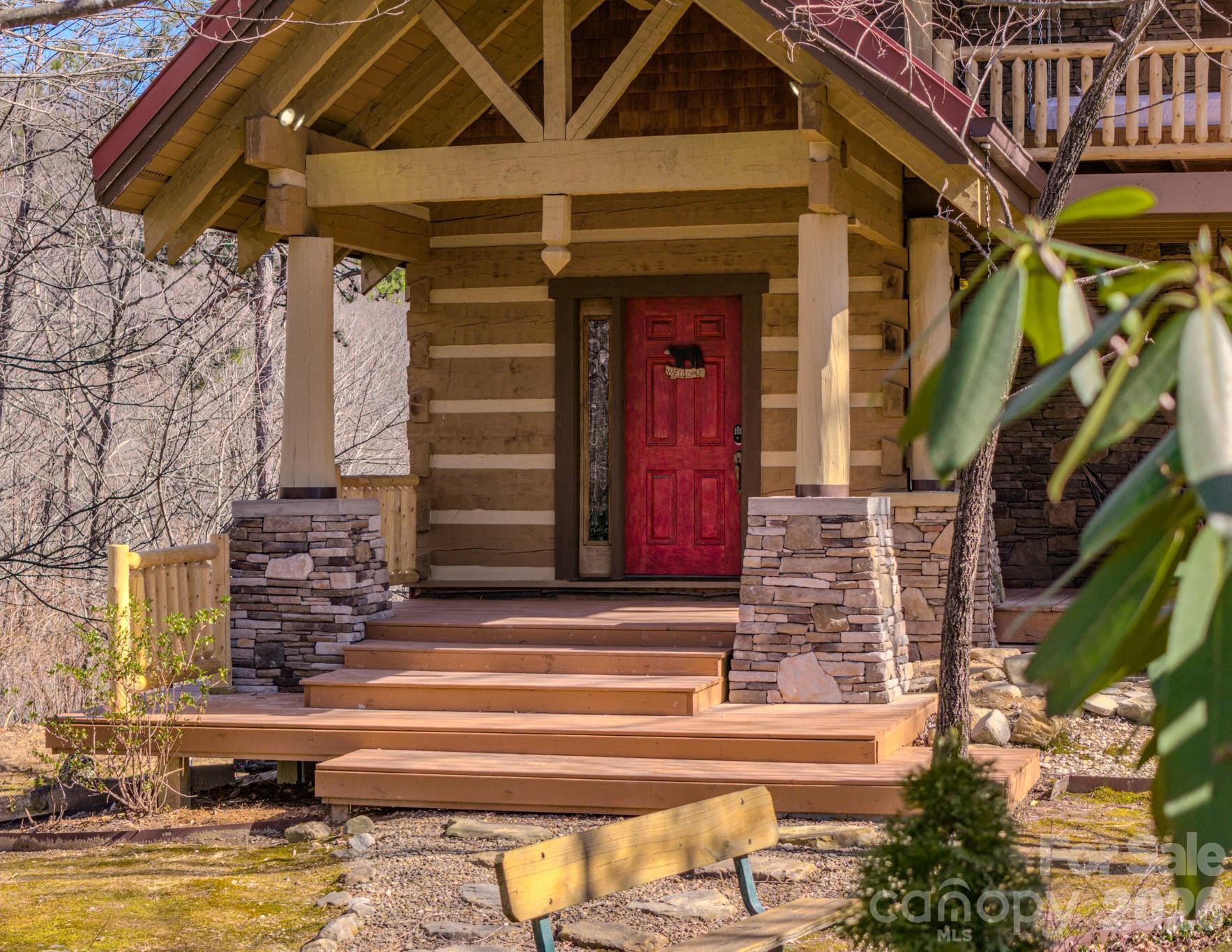 277 Long Ridge Road, Unit 882 889 Old Fort, NC 28762 - Photo 9 of 41 a front view of a house with a garden
