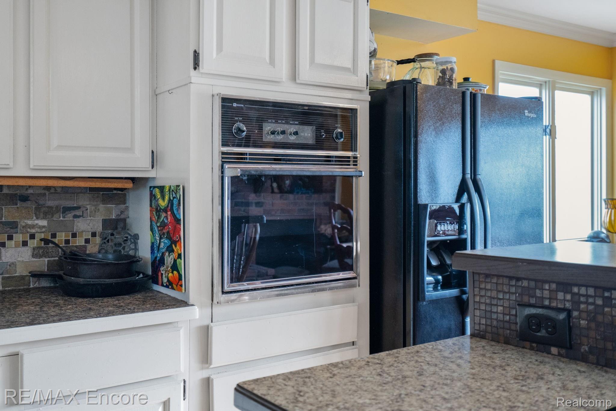 13450 Rattalee Lake Road Davisburg, MI 48350 - Photo 15 of 57 SPACE SAVING BUILT IN OVEN. KITCHEN APPLIANCES WILL REMAIN IN THE HOME.