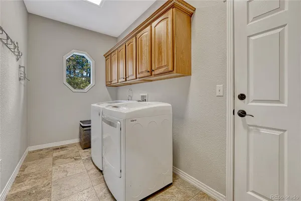 a utility room with a sink a washer and dryer