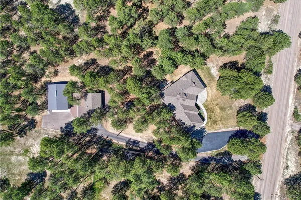 an aerial view of house with yard