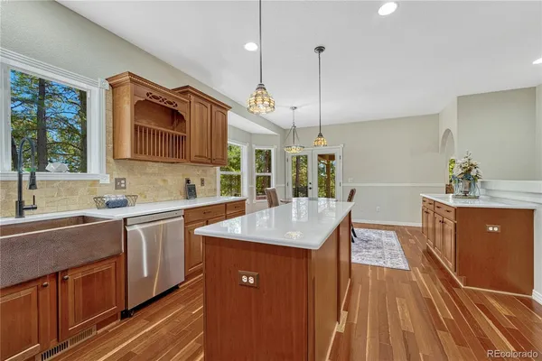 a kitchen with a sink stove and microwave