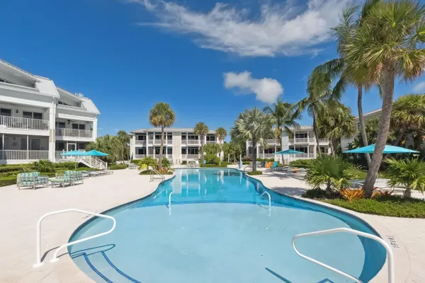a kitchen with a sink and refrigerator