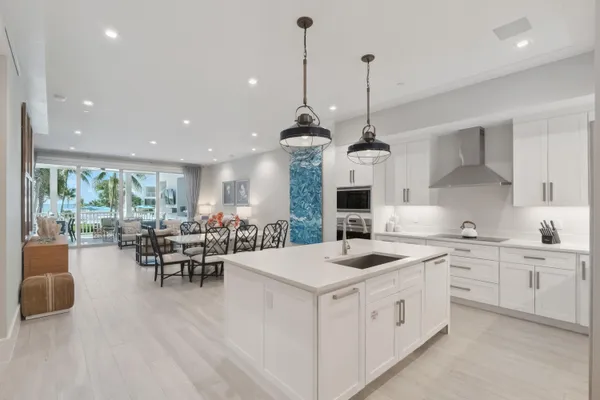 a front view of a house with swimming pool and sitting area