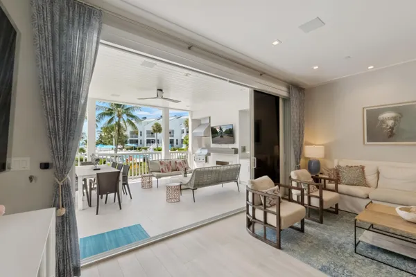 a view of a house with swimming pool and sitting area