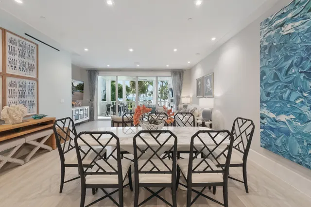 a view of a lake with chairs