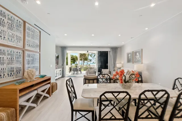 a view of a swimming pool with a table and chairs