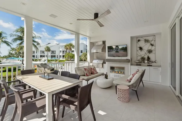 a living room with furniture fireplace and a flat screen tv