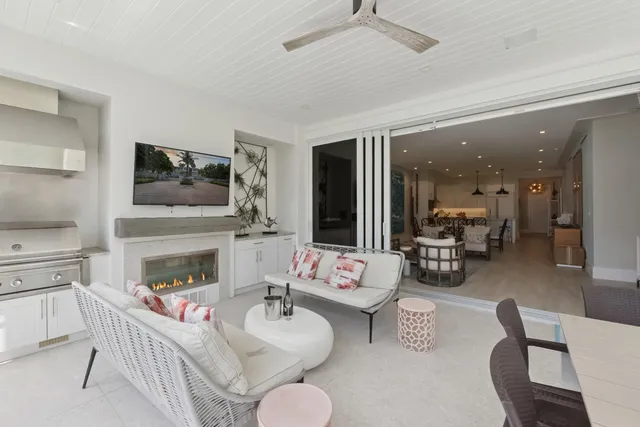 a bathroom with double vanity sinks a large mirror and a shower