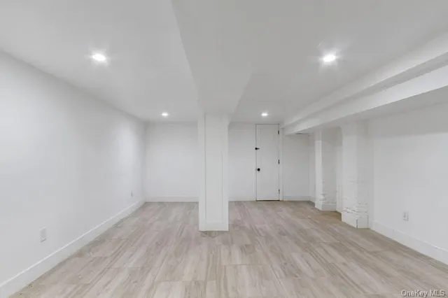 a view of room with wooden floor