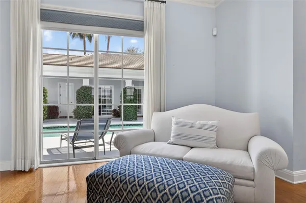 a room with lots of furniture and a chandelier