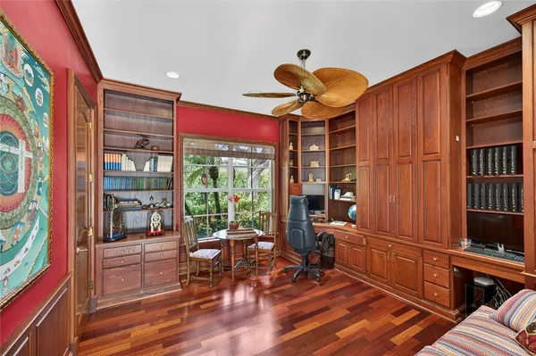 a living room with furniture a lamp and a large window