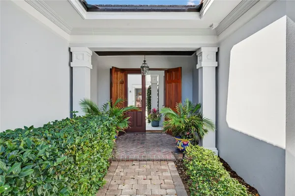 a living room with furniture fireplace and large window