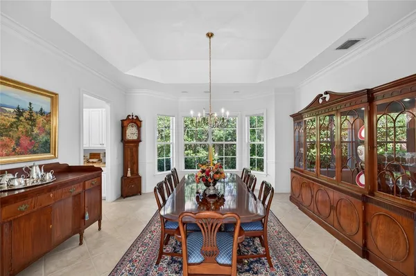 a view of a dining room with furniture window and outside view