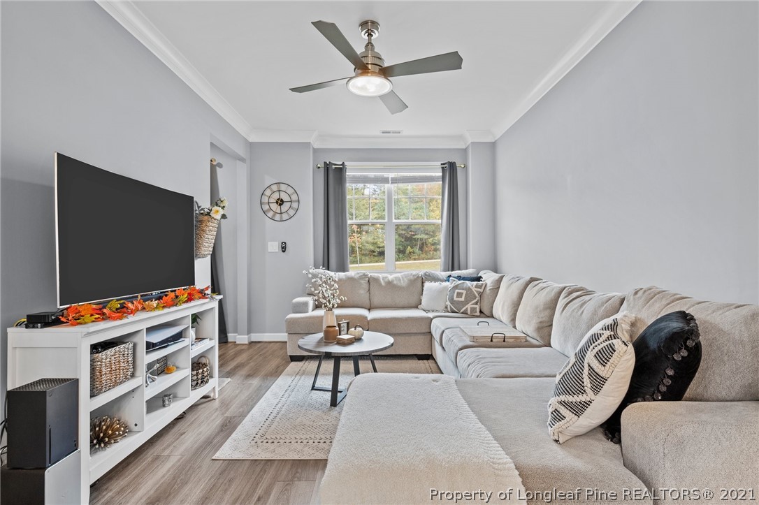 171 Apache Trail Sanford, NC 27332 - Photo 11 of 38 a living room with furniture and a flat screen tv